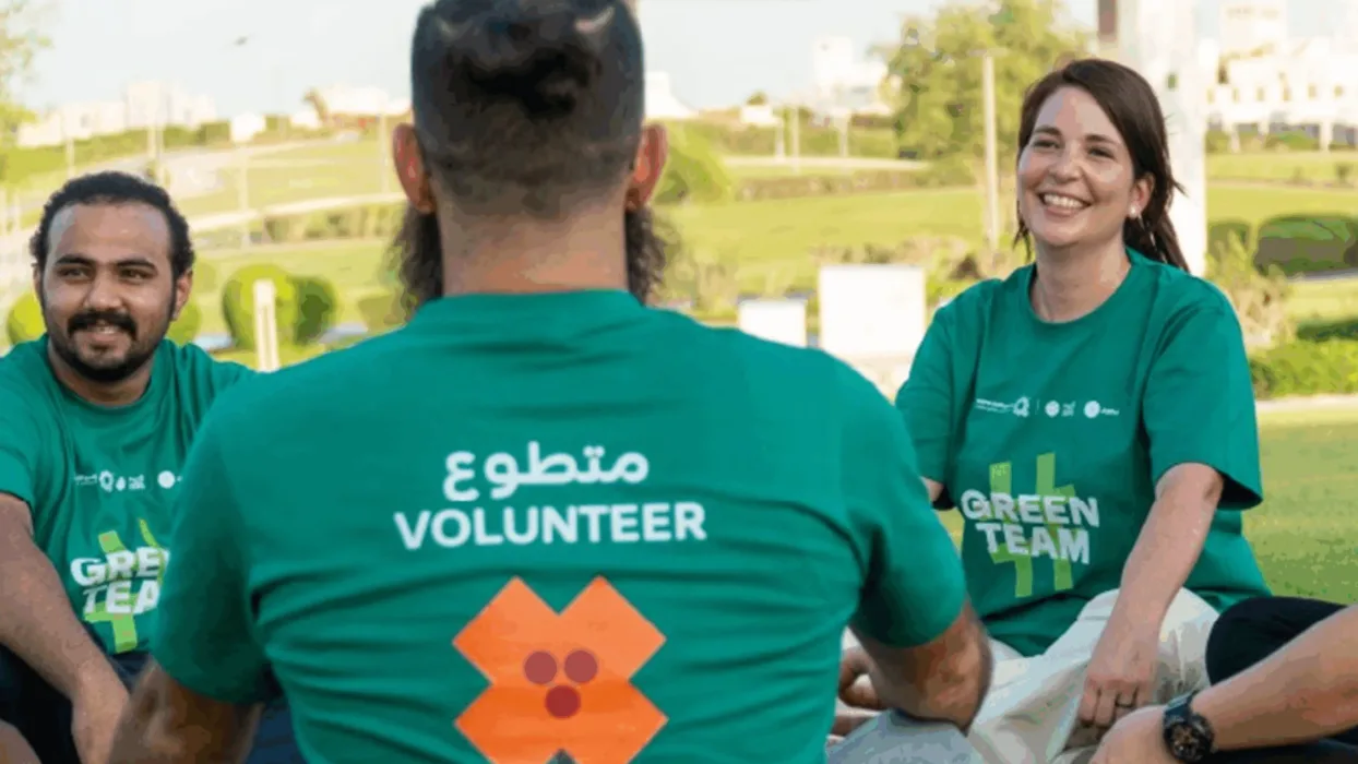 Doha volunteers in green t-shirts