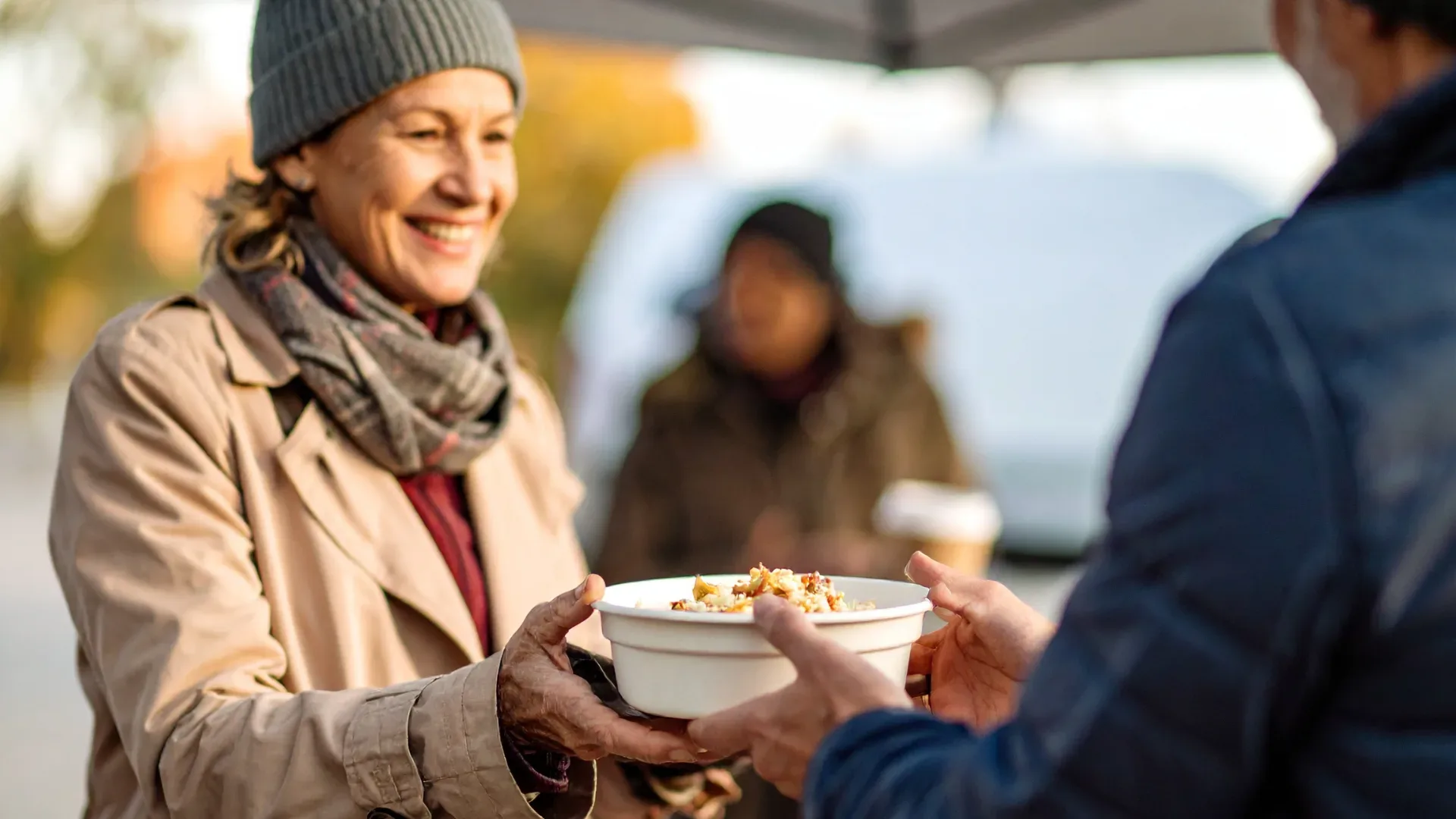 Woman serving food at soup kitchen