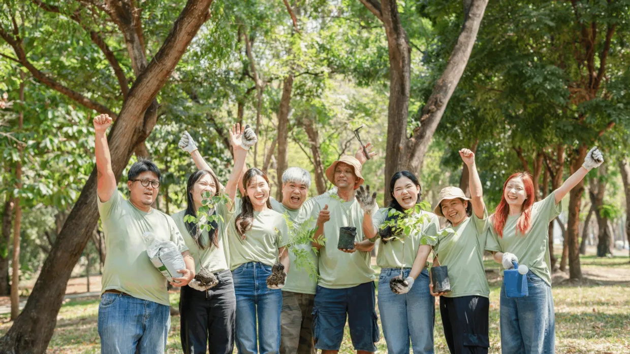 Group of happy volunteers outdoors