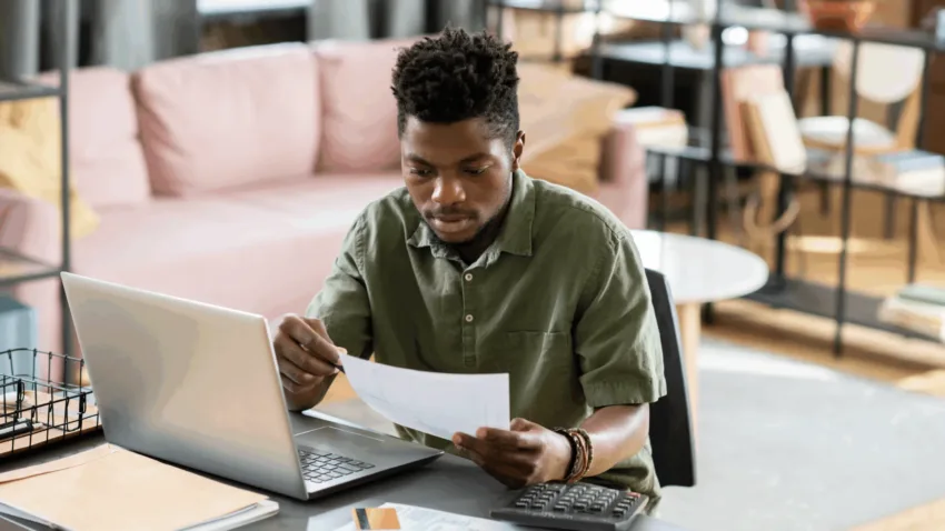 Man at desk reading document