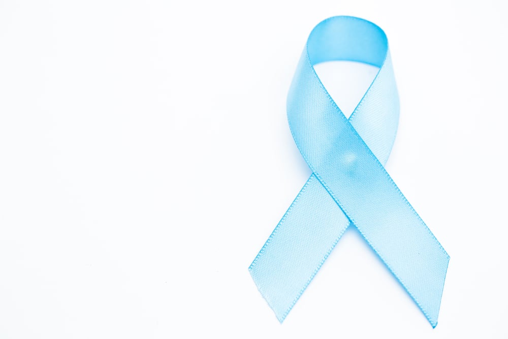 Blue ribbon for prostate cancer on white background