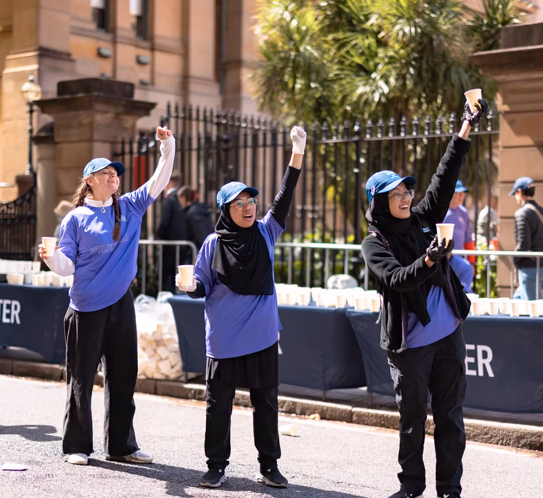 Sydney Marathon volunteers cheering on runners