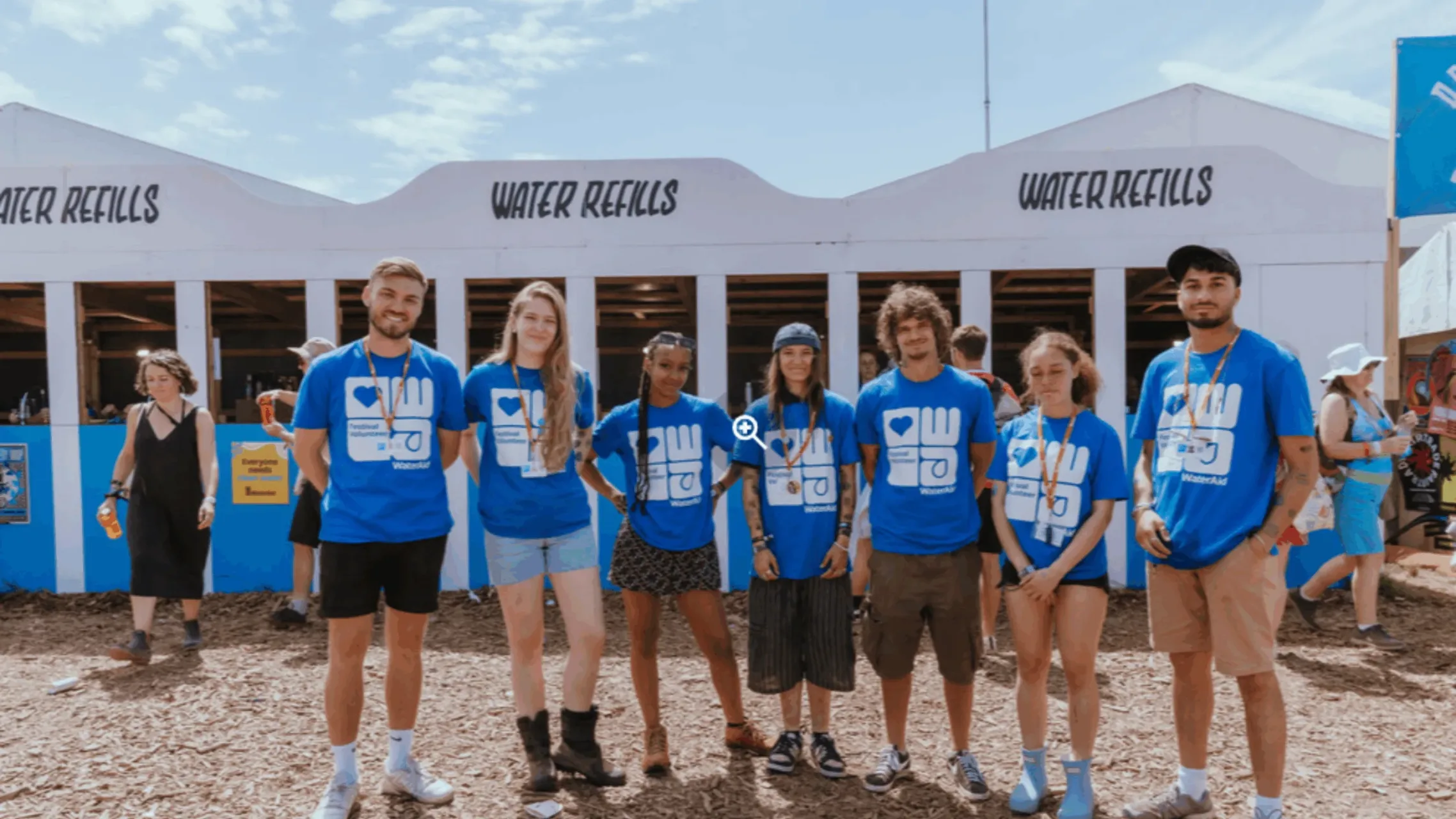 WaterAid volunteers smiling at camera