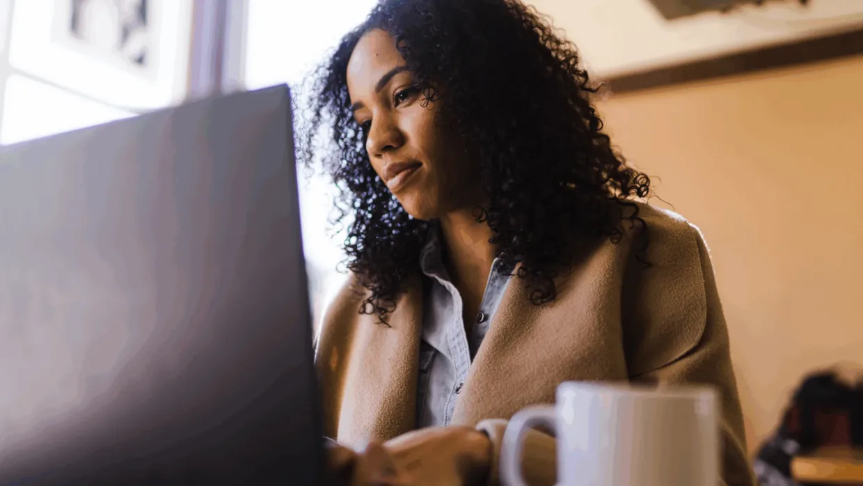 Woman looking at laptop