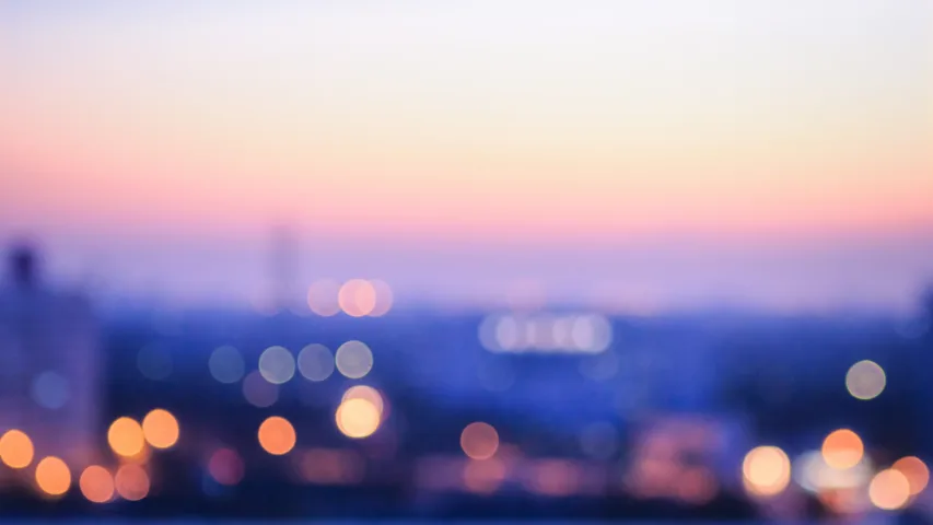 Twinkling lights in the city with foreground blurred