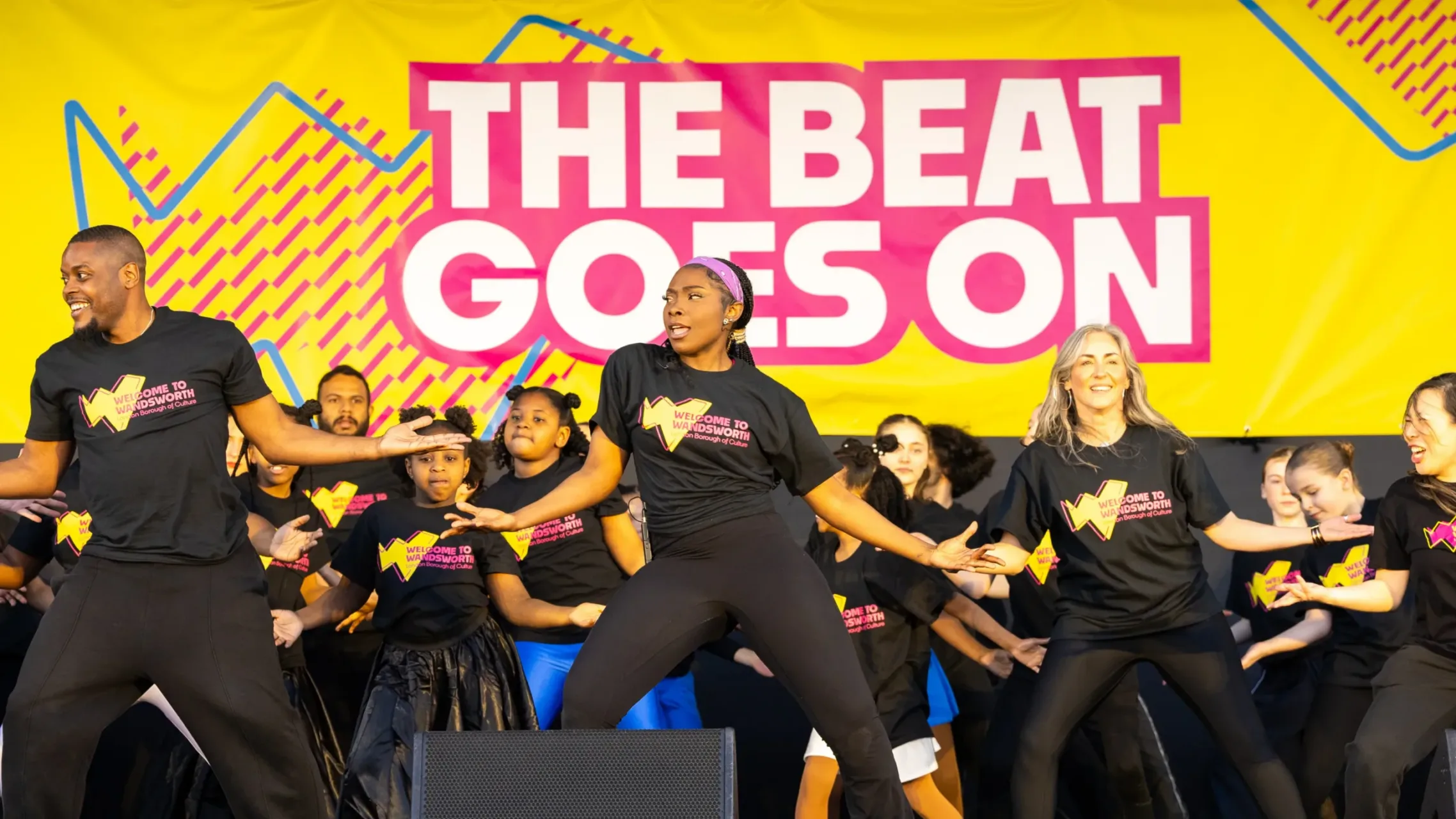 Dance group on stage performing at The Beat Goes On in London