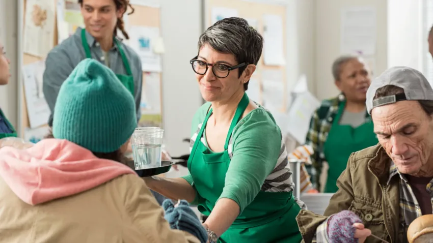 Volunteer working in a food bank or homeless shelter