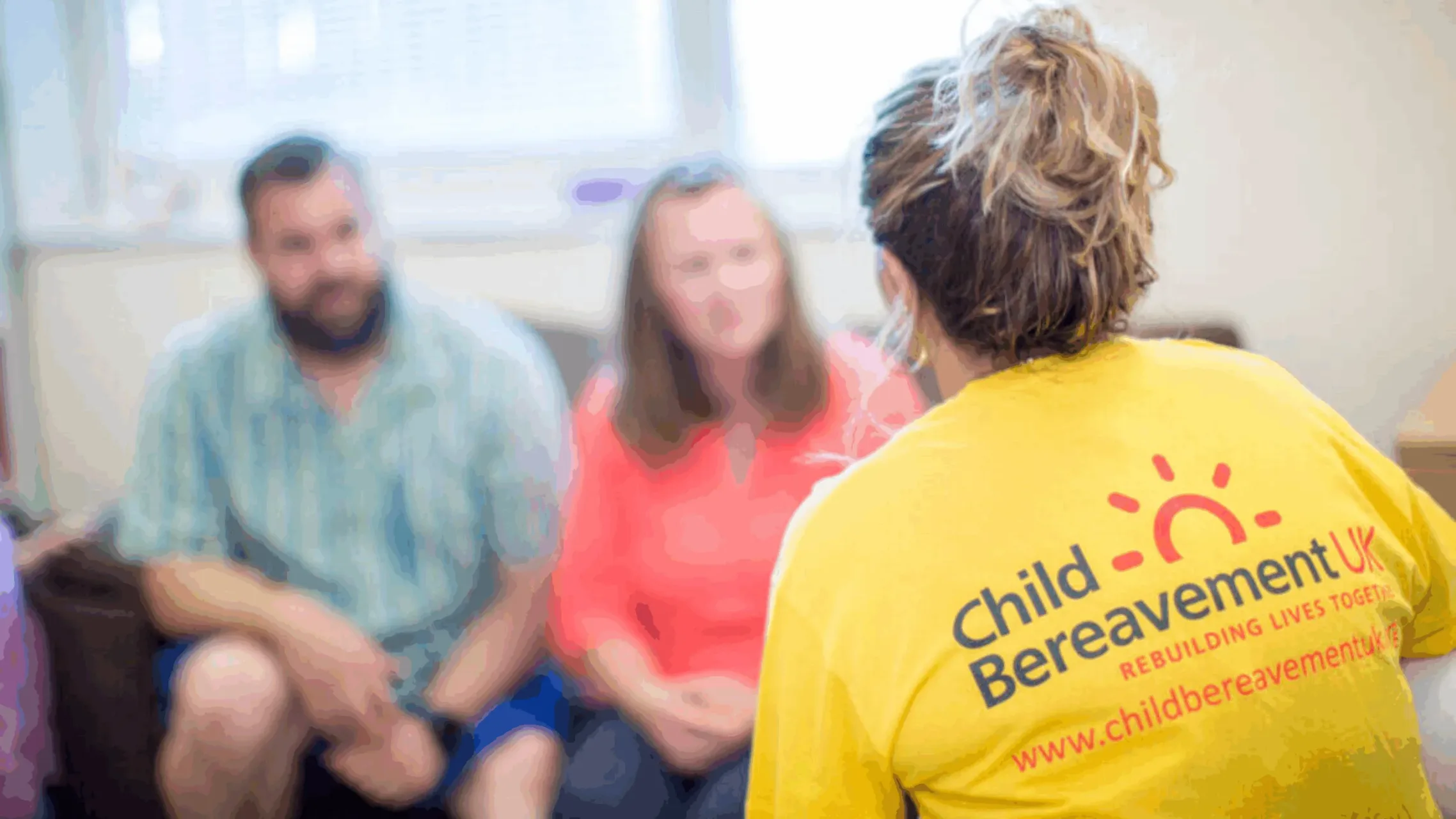 Child Bereavement UK volunteer speaking to parents