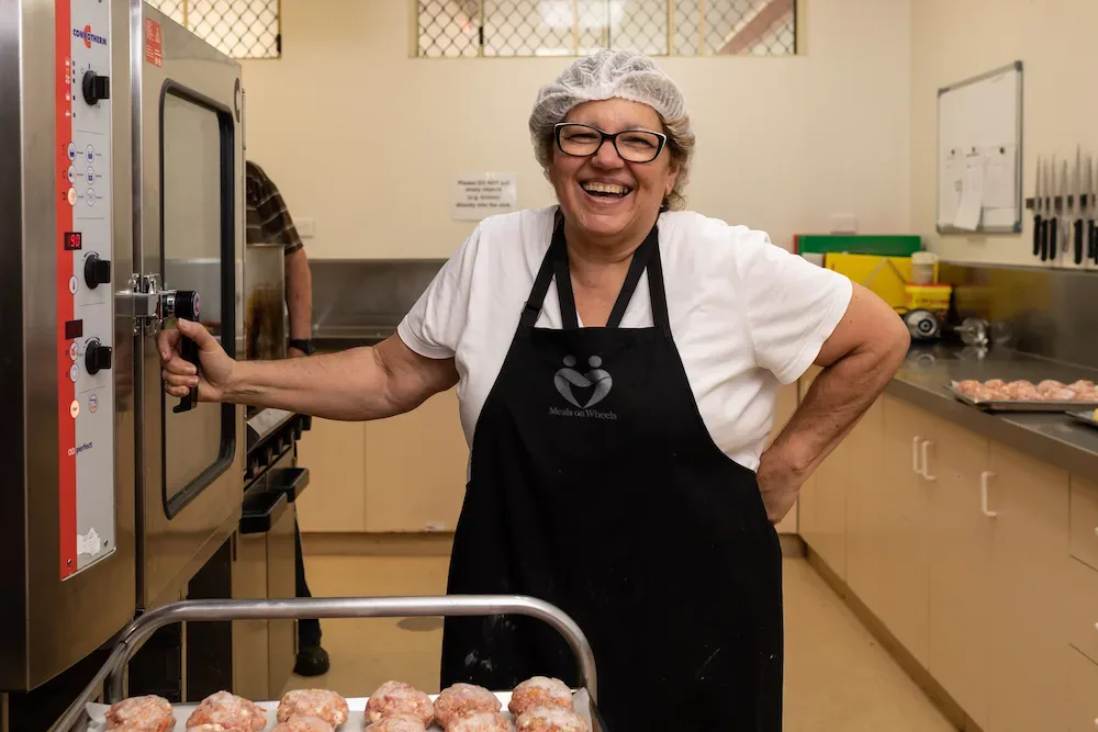 Meals on Wheels Queensland volunteer in kitchen