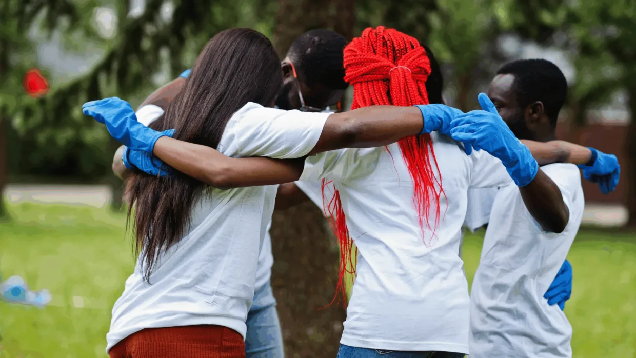 Volunteers in group hug