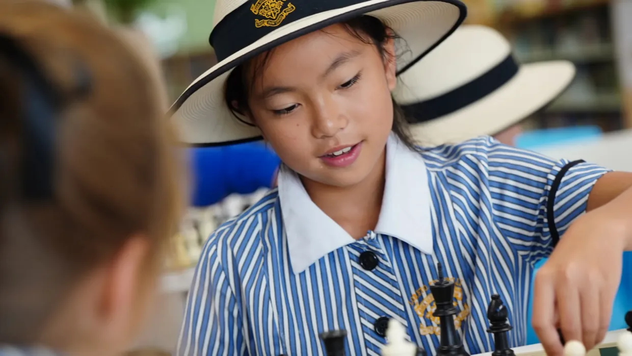 Loreto Kirribilli young girl in school uniform playing chess