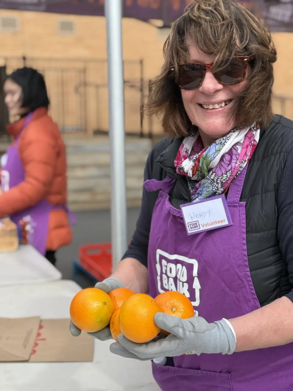 Foodbank Volunteer in warehouse helping with food prep